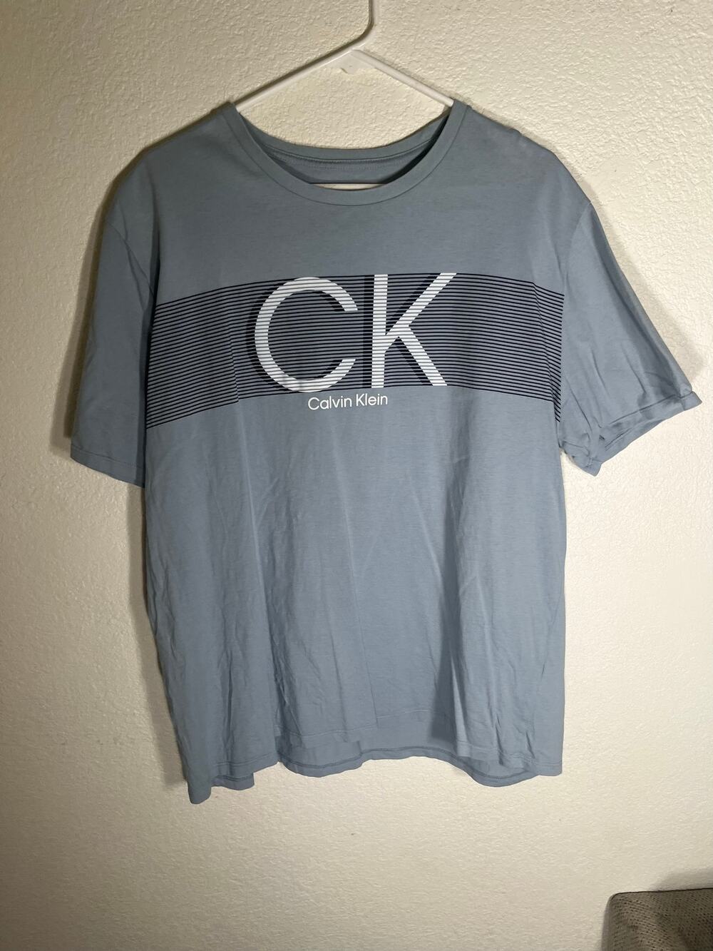 Calvin Klein XL blue T-Shirt w/graphic design-used good condition